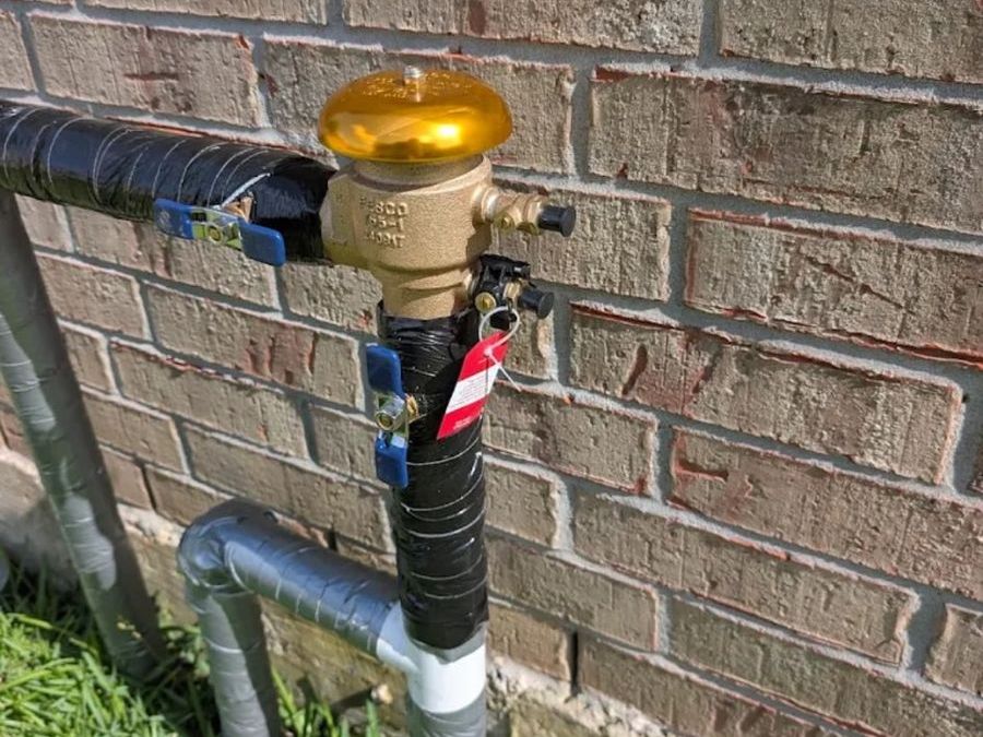 Backflow preventer installed in an open valve box